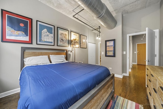 bedroom featuring dark hardwood / wood-style floors