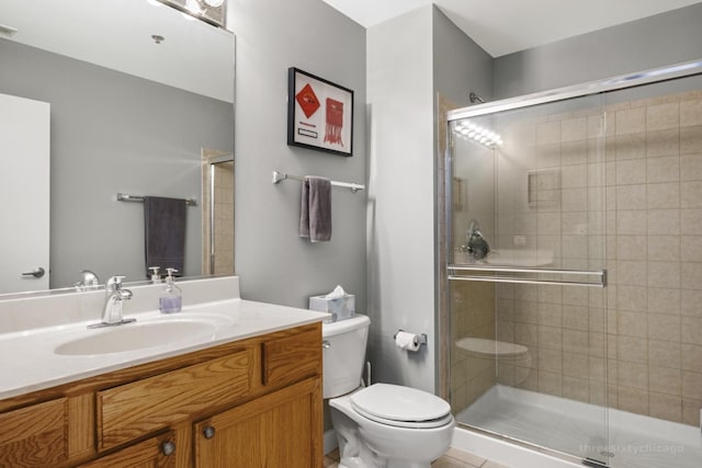 bathroom featuring walk in shower, vanity, and toilet