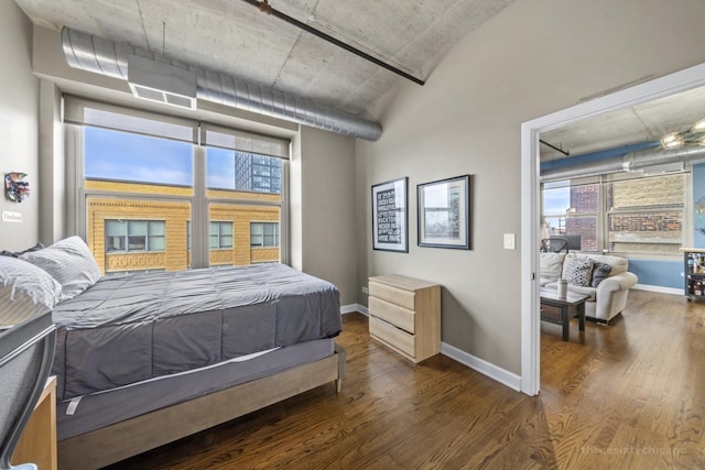 bedroom with dark wood-type flooring