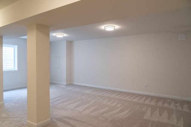 basement featuring light colored carpet