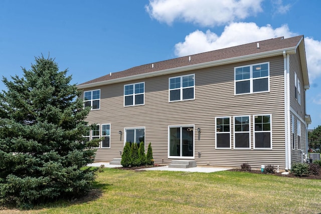 back of house with a patio and a yard