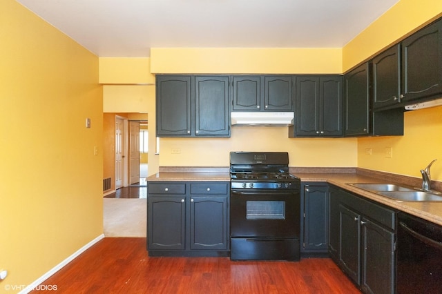 kitchen with sink, dark hardwood / wood-style flooring, and black appliances