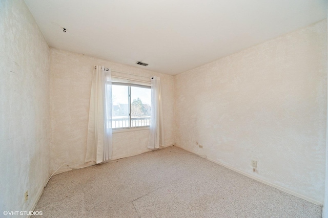 empty room with light colored carpet