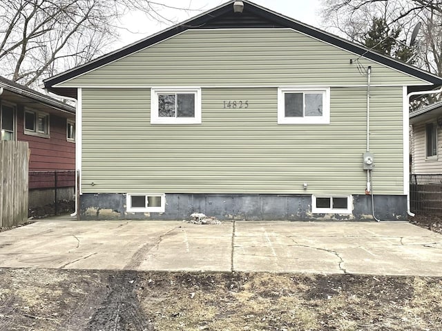 view of side of property with a patio