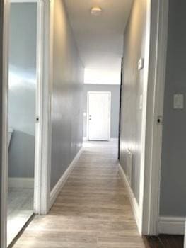 hall with light hardwood / wood-style flooring