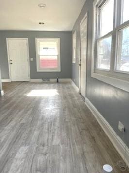 interior space with hardwood / wood-style floors