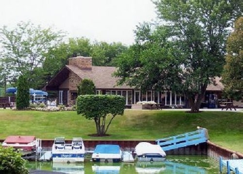 48 Oak Hill Colony Unit 2, Fox Lake, IL 60020 - dock featuring a lawn