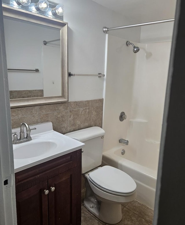 48 Oak Hill Colony Unit 2, Fox Lake, IL 60020 - bathroom featuring vanity, bathing tub / shower combination, toilet, tile patterned floors, and tile walls
