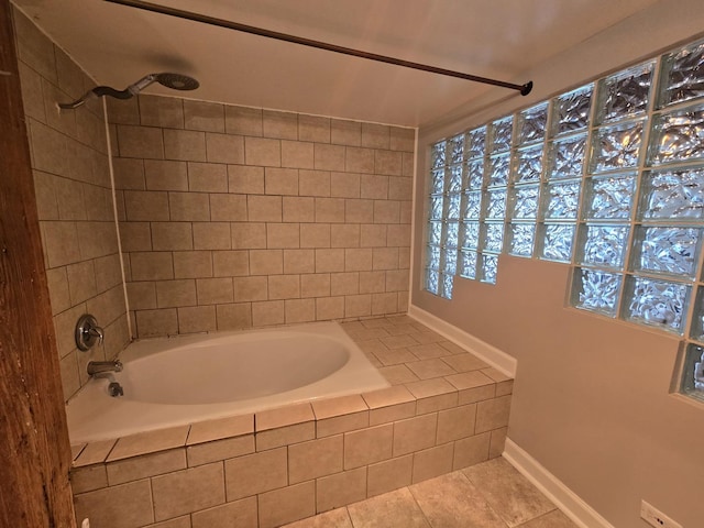 bathroom with tiled shower / bath and tile patterned floors