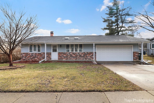 ranch-style home with a garage and a front yard