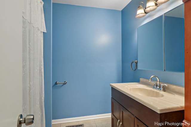 bathroom with vanity and tile patterned floors