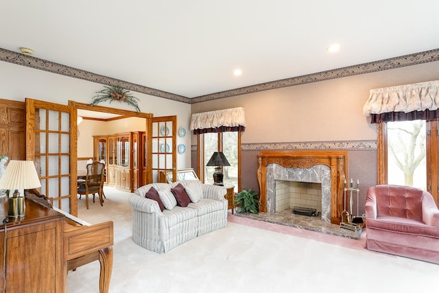 living room with carpet and a high end fireplace