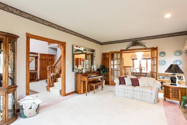 living room featuring french doors and light colored carpet