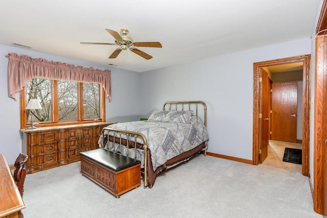 bedroom featuring light colored carpet and ceiling fan