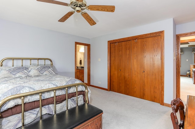 carpeted bedroom featuring a closet and ceiling fan