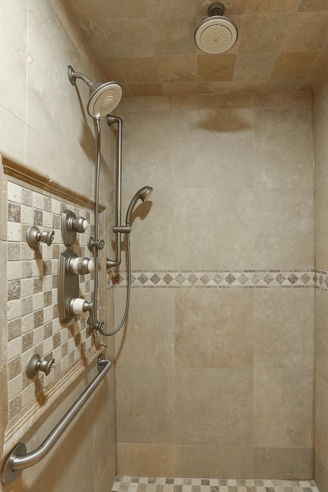 bathroom with a tile shower