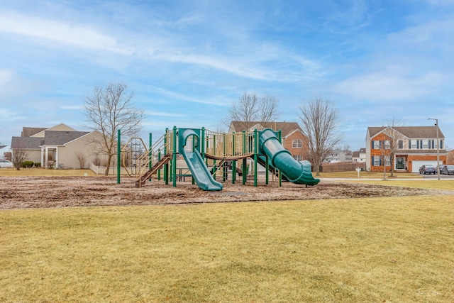 community jungle gym with a yard