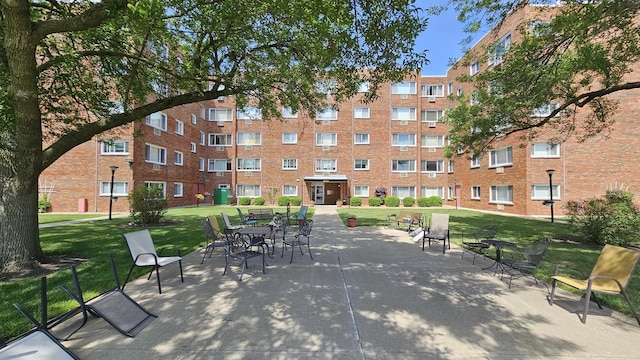 222 Madison St Unit 107, Joliet, IL 60435 - surrounding community featuring a lawn