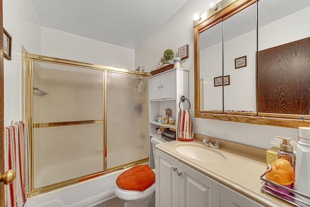 full bathroom with toilet, vanity, and shower / bath combination with glass door