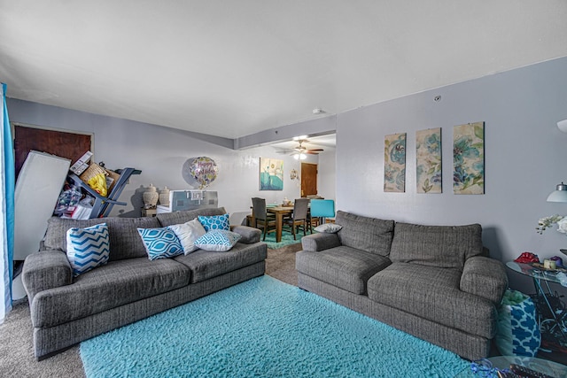 living room featuring carpet and ceiling fan