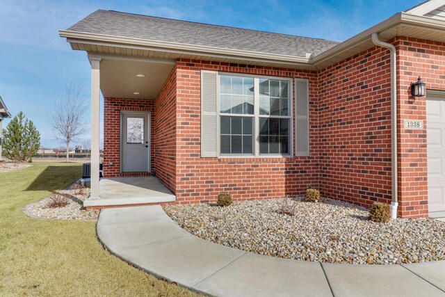 ranch-style house with a garage and central AC