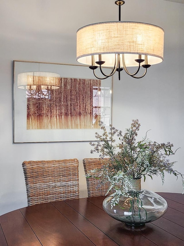 dining space featuring a notable chandelier