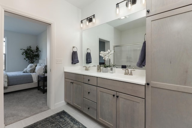 bathroom featuring vanity and a shower with shower door