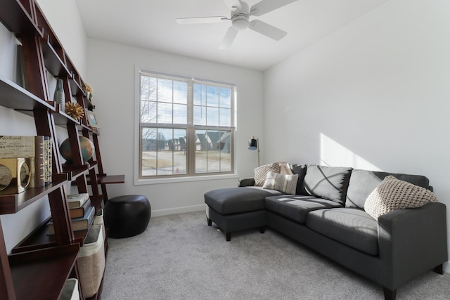 carpeted living room with ceiling fan