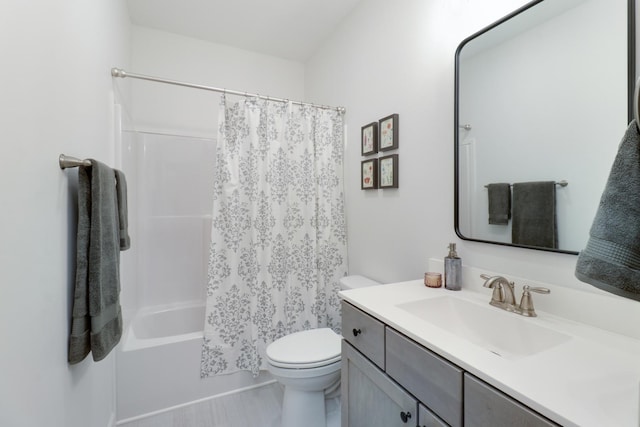 full bathroom with vanity, shower / bath combination with curtain, and toilet