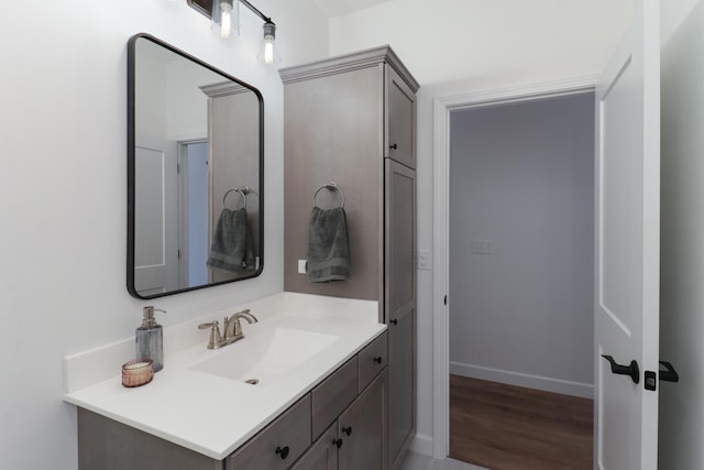 bathroom with vanity and hardwood / wood-style floors