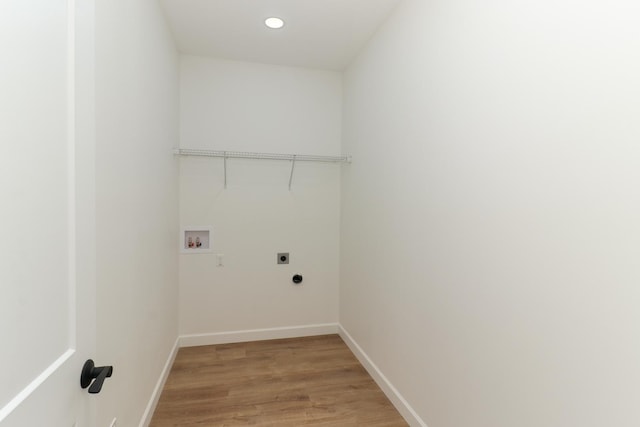 laundry area with washer hookup, hardwood / wood-style flooring, and hookup for an electric dryer