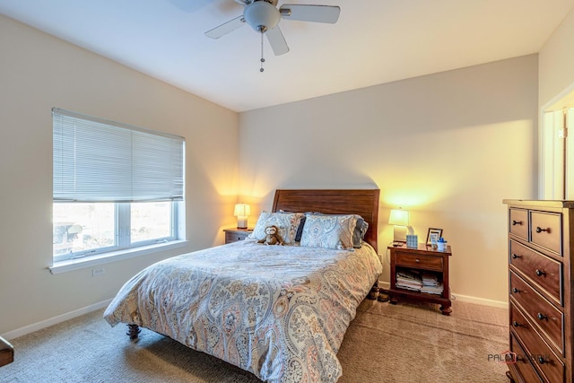 bedroom featuring light colored carpet and ceiling fan