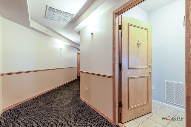 corridor with light tile patterned floors