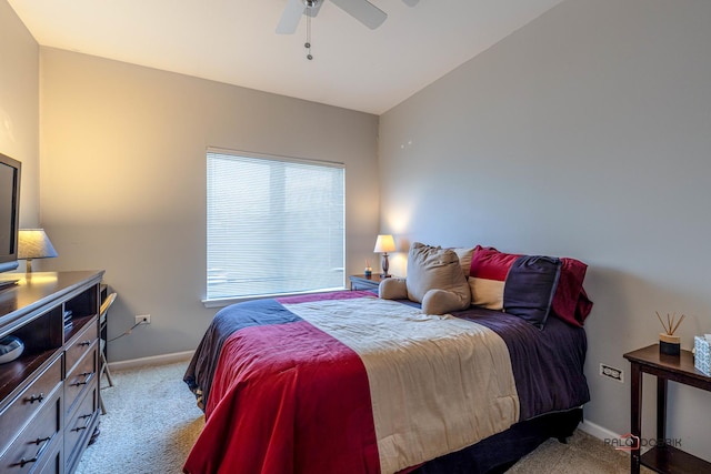 bedroom with ceiling fan and light carpet