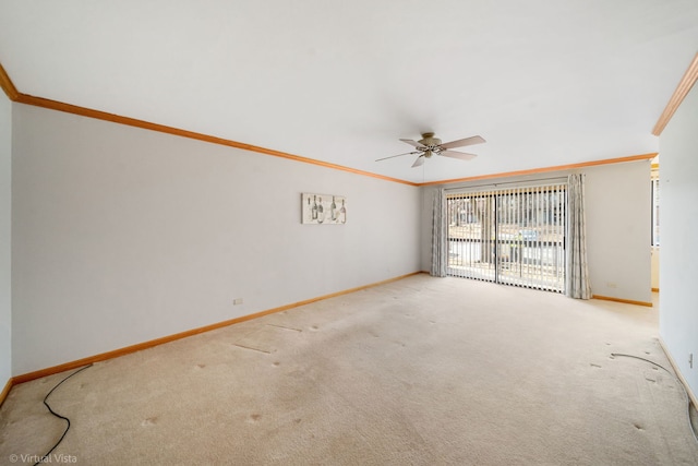 carpeted empty room with crown molding and ceiling fan