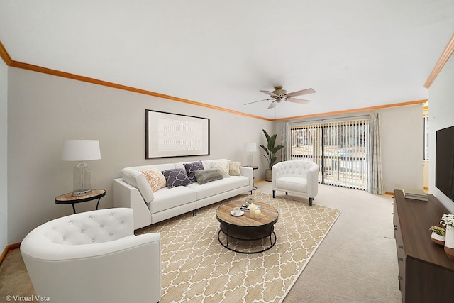 carpeted living room featuring ornamental molding and ceiling fan