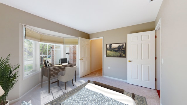 bedroom featuring light carpet