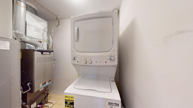 laundry room featuring stacked washer and clothes dryer