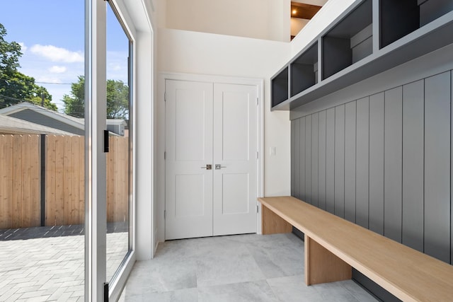 mudroom with wooden walls