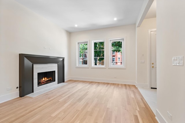 unfurnished living room featuring light hardwood / wood-style flooring