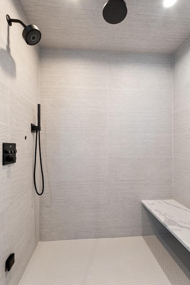 bathroom with tiled shower