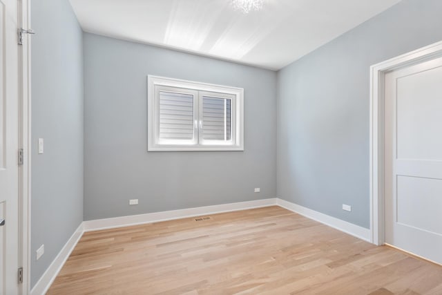 spare room featuring light hardwood / wood-style flooring