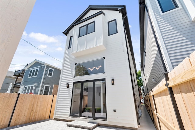 back of house with a patio