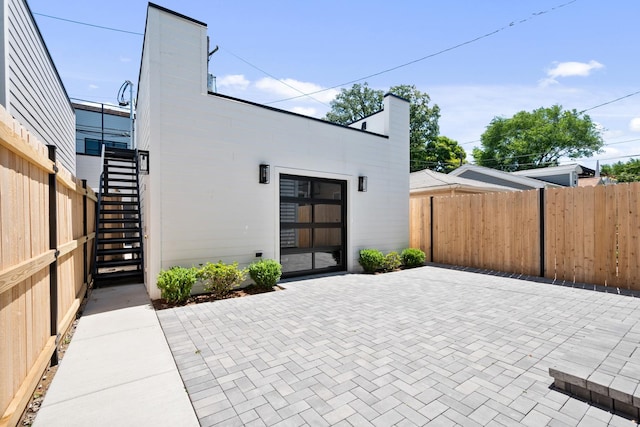 rear view of property featuring a patio area