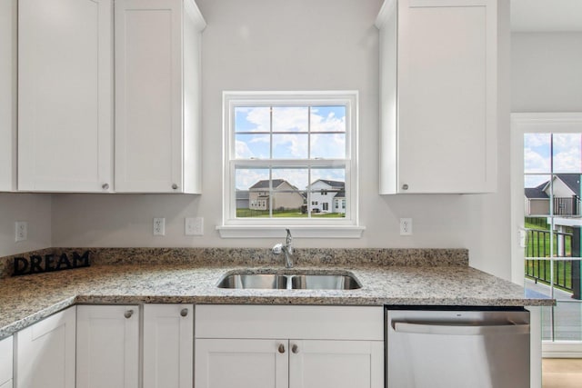 607 Virginia St, Elburn, IL 60119 - kitchen featuring stainless steel dishwasher, white cabinets, and light stone countertops
