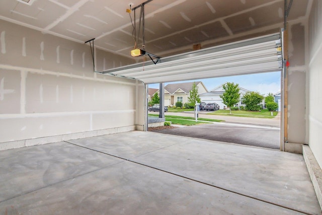 607 Virginia St, Elburn, IL 60119 - garage featuring a garage door opener and a residential view