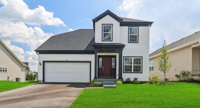 607 Virginia St, Elburn, IL 60119 - traditional home with asphalt driveway, a front yard, an attached garage, and a shingled roof