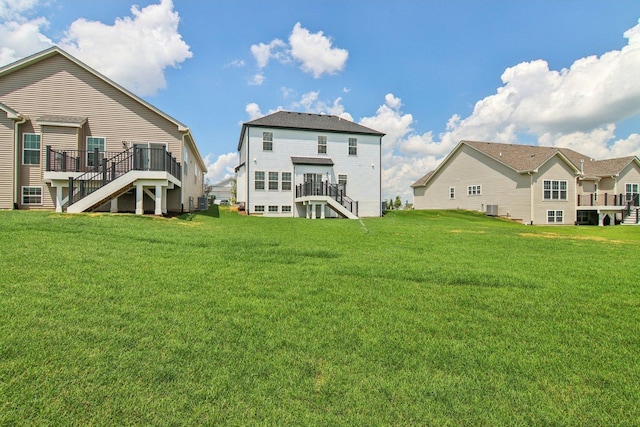 607 Virginia St, Elburn, IL 60119 - rear view of house with stairs, a deck, and a yard