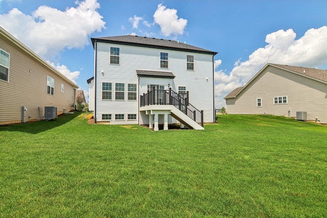 607 Virginia St, Elburn, IL 60119 - rear view of house with stairway, a wooden deck, and a yard
