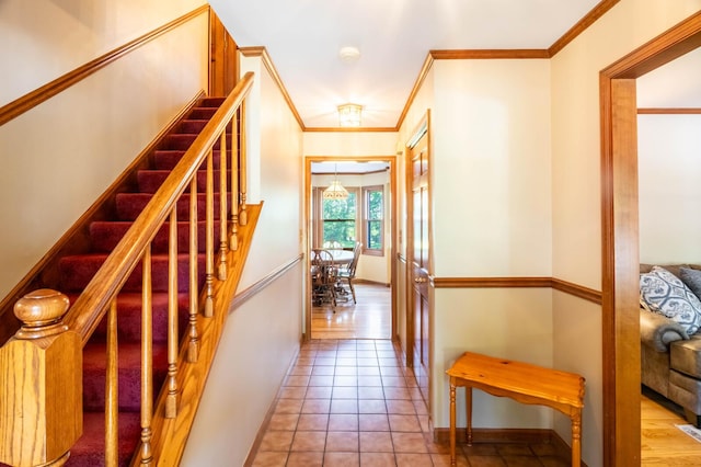 interior space featuring light tile patterned flooring and ornamental molding